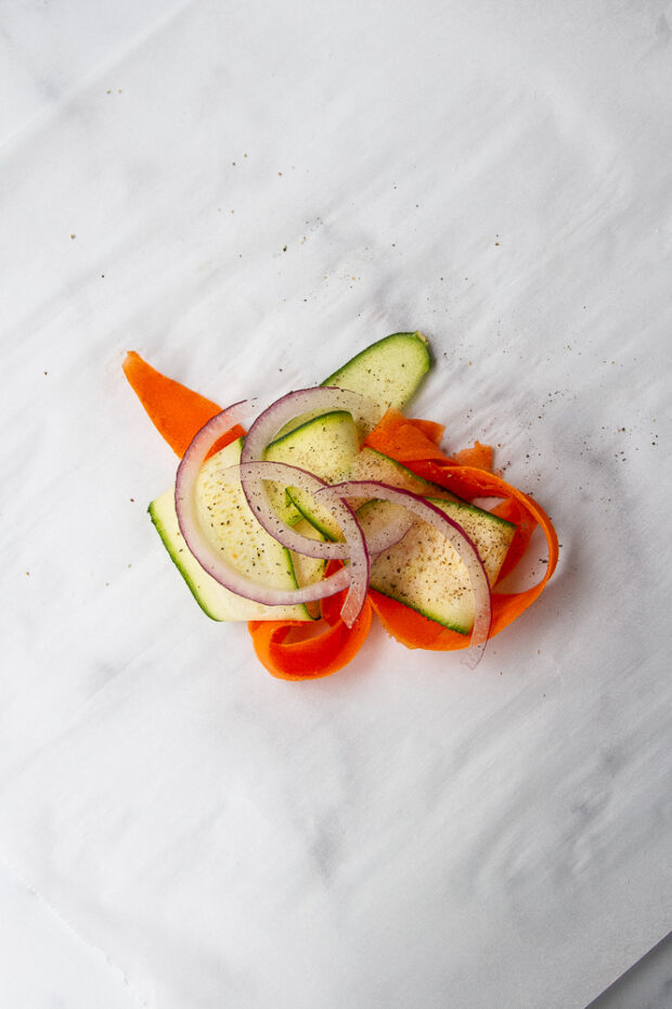 Layered vegetables on parchment.