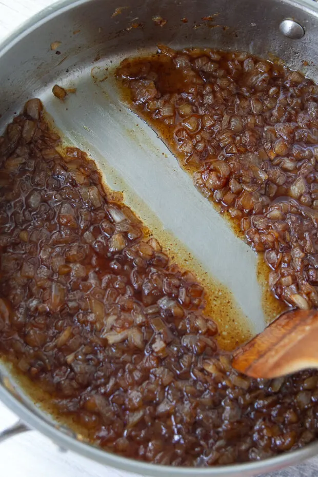 Caramelized onions have simmered and reduced so the sauce is thicker.