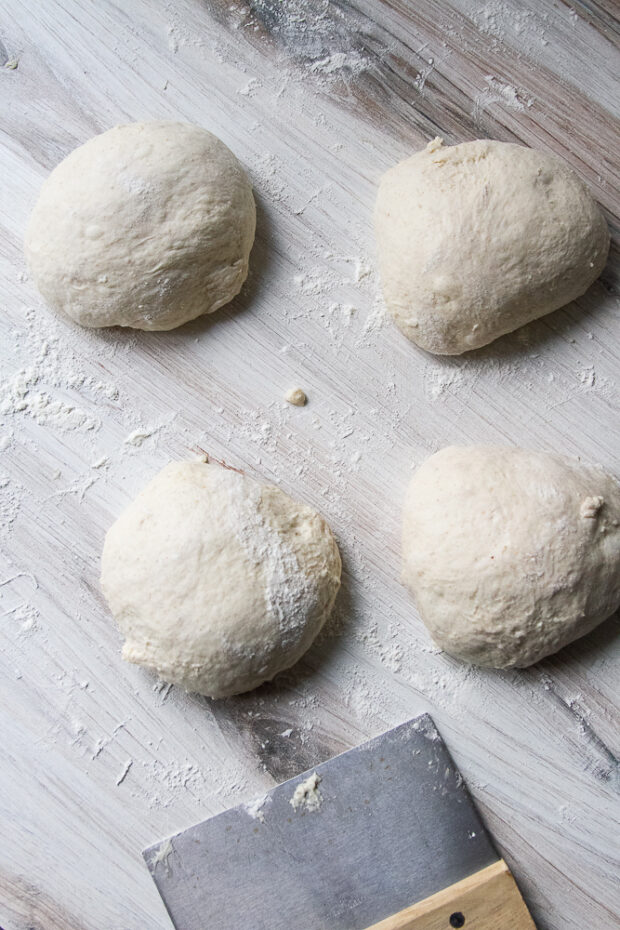 Dough pieces formed into tight balls. 