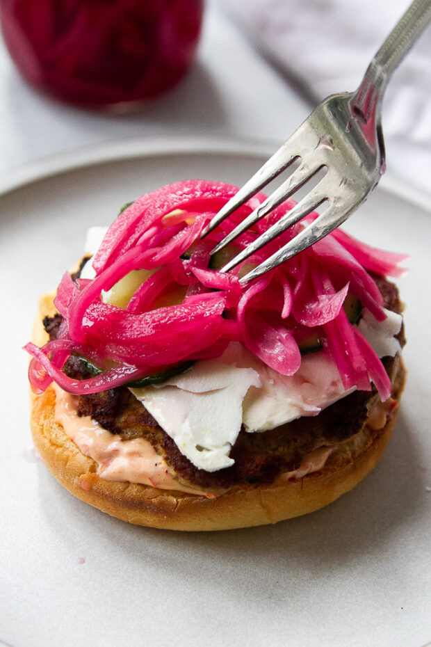 Pickled red onions added to the burger to finish it off. 