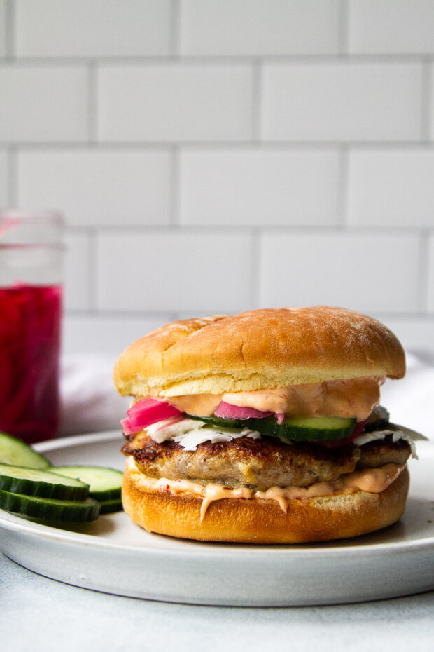 Shawarma Turkey Burger with spicy mayo, cucumbers, feta, and pickled onions.