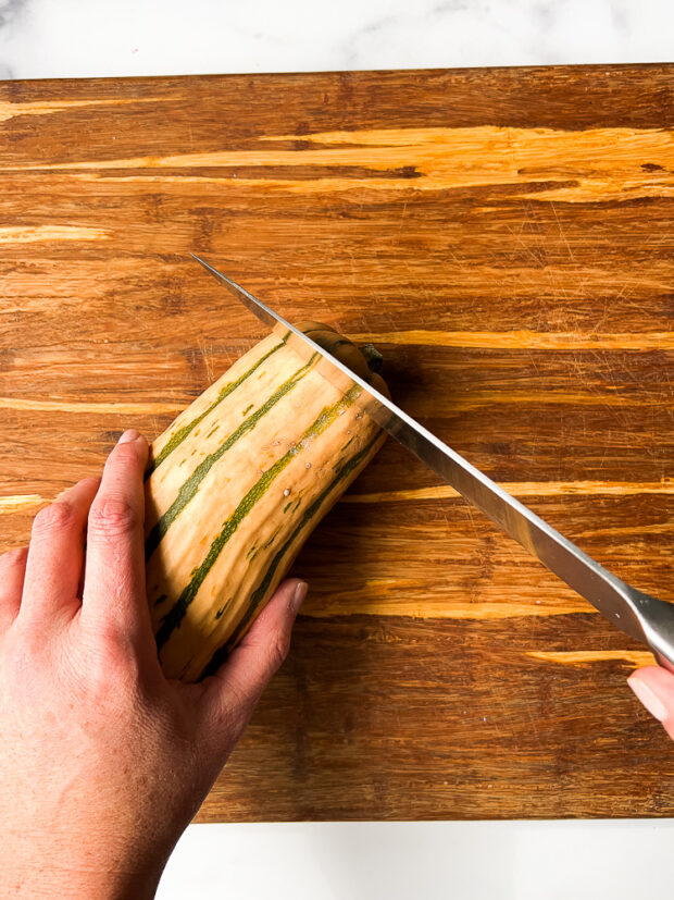 Cutting off the stem end of the squash.