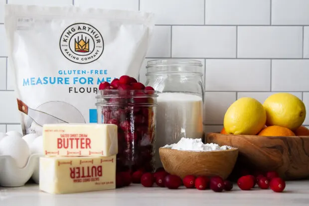 Ingredients for the cranberry tart: gluten free flour, eggs, butter, fresh cranberries, sugar, powdered sugar, lemons, and oranges.