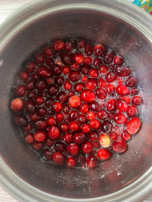 Cranberries simmering in a little water and sugar.