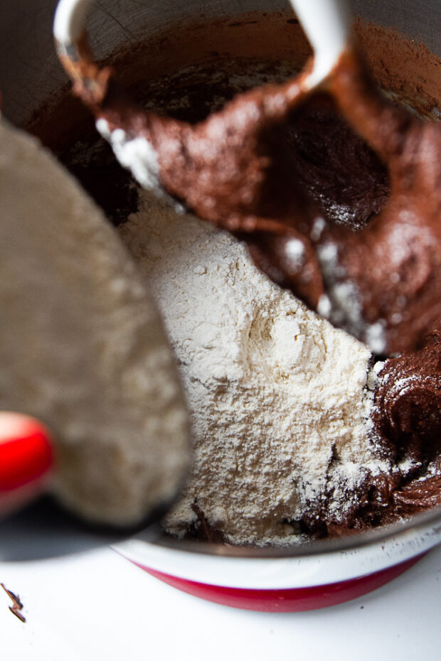 Dry ingredients being added to the cookie dough. 